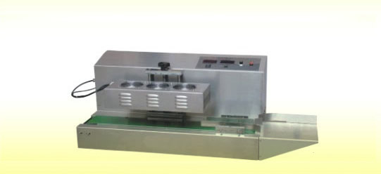 Continuous induction sealing machine